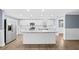Bright kitchen with white cabinetry, granite countertops, and stainless steel appliances at 8804 Harrison Rd, Lakeland, FL 33810