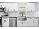Well-equipped kitchen with granite countertops, stainless steel sink and modern appliances at 8804 Harrison Rd, Lakeland, FL 33810