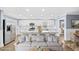 Open kitchen with seating at island, leading into living area with comfortable seating at 8804 Harrison Rd, Lakeland, FL 33810