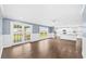 Spacious living area with access to backyard, flowing into kitchen with an island at 8804 Harrison Rd, Lakeland, FL 33810