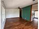 Spacious living room with hardwood floors, ceiling fan, and plenty of natural light at 11407 Bobwhite Blvd, Leesburg, FL 34788