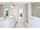 Bathroom featuring double vanity, shower with glass enclosure, and tiled flooring at 1403 Hamilton Way, Lake Alfred, FL 33850