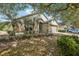 Charming single-Gathering home with a well-maintained front yard, lush landscaping, and inviting entrance at 30653 Pga Dr, Sorrento, FL 32776