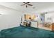 Comfortable living room with a ceiling fan, and an open layout to kitchen and dining at 30653 Pga Dr, Sorrento, FL 32776