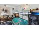 Spacious office with desk, sewing machine and plenty of natural light from a large window at 30653 Pga Dr, Sorrento, FL 32776