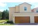Charming two-story home features a two-car garage and well-maintained landscaping at 575 Bay Leaf Dr, Poinciana, FL 34759