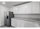 Bright kitchen featuring stainless steel refrigerator and granite countertops at 575 Bay Leaf Dr, Poinciana, FL 34759