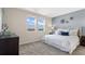 Inviting bedroom featuring large windows, a plush bed, and tasteful decor at 612 Terrapin Dr, Debary, FL 32713