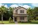 Charming two-story home with a well-manicured lawn and inviting front porch at 612 Terrapin Dr, Debary, FL 32713
