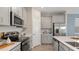 Modern kitchen featuring stainless steel appliances and sleek countertops at 612 Terrapin Dr, Debary, FL 32713