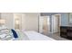 Spacious bedroom features a plush bed, dresser, and easy access to the en suite bathroom at 614 Terrapin Dr, Debary, FL 32713