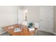 Bright home office space with a laptop, modern desk, and comfortable seating at 614 Terrapin Dr, Debary, FL 32713