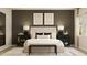 Stylishly decorated bedroom showcasing a neutral palette, plush bed, elegant bedside tables and decorative lighting at 698 Peroni Ave, Debary, FL 32713