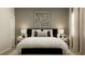 Comfortable bedroom featuring a queen bed with white linens and stylish bedside tables with decorative lamps at 698 Peroni Ave, Debary, FL 32713