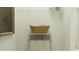 Functional laundry area with storage shelving and a three-compartment laundry sorter for organization at 703 Peroni Ave, Debary, FL 32713