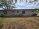Back exterior view of a home with natural landscape at 917 Adamson Ct, Lake Alfred, FL 33850