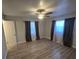 Spacious bedroom with wood flooring, neutral walls, and plenty of natural light at 917 Adamson Ct, Lake Alfred, FL 33850