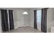 Cozy dining area features stylish gray walls, wood flooring, and a modern light fixture at 917 Adamson Ct, Lake Alfred, FL 33850