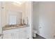Spacious bathroom showcasing double sinks, granite counters, and a tiled floor at 14404 Sw 19Th Pl, Ocala, FL 34481