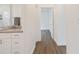 Well-lit bathroom featuring double sinks with granite counters and modern fixtures at 14404 Sw 19Th Pl, Ocala, FL 34481