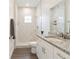 Modern bathroom features white marble tiling and granite countertops at 14404 Sw 19Th Pl, Ocala, FL 34481
