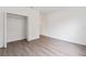 Spacious bedroom with wood-look floors, closet, and neutral paint at 14404 Sw 19Th Pl, Ocala, FL 34481