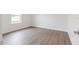 Bedroom with a window, wood-style flooring, and neutral walls at 14404 Sw 19Th Pl, Ocala, FL 34481