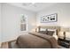 Comfortable bedroom featuring a large bed, neutral color palette, and natural light from the window creating a peaceful space at 406 W Valencia St, Lakeland, FL 33805
