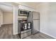 A kitchen showcasing stainless steel appliances including a range and refrigerator, and ample storage at 406 W Valencia St, Lakeland, FL 33805