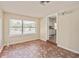 A room with a unique tile floor and a large window providing natural light, open to kitchen at 406 W Valencia St, Lakeland, FL 33805