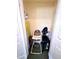 Storage closet with a variety of household items, including a high chair at 7673 Heritage Crossing Way # 202, Reunion, FL 34747