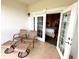 Outdoor patio furniture invites you to relax outside and enjoy the view of the golf course at 7673 Heritage Crossing Way # 202, Reunion, FL 34747