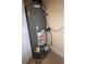 Classic Plus Rheem water heater with associated pipes and electrical components at 7673 Heritage Crossing Way # 202, Reunion, FL 34747