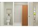 Clean bathroom featuring a shower with tile surround and an orange shower curtain at 990 Hour Glass Rd, Lakeland, FL 33801