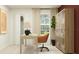 Well-lit home office featuring neutral tones, a spacious desk, storage cabinet, and comfortable seating at 990 Hour Glass Rd, Lakeland, FL 33801