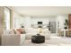 Open-concept living area with modern kitchen, dining space, and a cozy seating area at 990 Hour Glass Rd, Lakeland, FL 33801