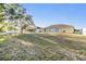 Expansive backyard featuring a well-kept lawn, creating a serene outdoor space at 2138 Mirasol Dr, Winter Haven, FL 33881