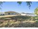 Spacious backyard with well-maintained lawn and white fence; perfect for outdoor enjoyment at 2138 Mirasol Dr, Winter Haven, FL 33881