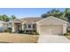 Charming home with a well-maintained lawn, two-car garage, and beautiful landscaping at 2138 Mirasol Dr, Winter Haven, FL 33881