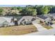 Inviting single-story home with an attached two-car garage and a well-kept lawn at 2138 Mirasol Dr, Winter Haven, FL 33881