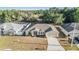 Charming single-story home featuring an attached garage and complemented by mature landscaping at 2138 Mirasol Dr, Winter Haven, FL 33881