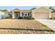 Charming single-story home with a two-car garage and well-maintained landscaping at 2138 Mirasol Dr, Winter Haven, FL 33881