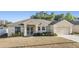 Inviting single-Gathering home with well-kept landscaping, a two-car garage, and a manicured lawn at 2138 Mirasol Dr, Winter Haven, FL 33881