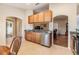 Charming kitchen boasts stainless steel appliances, granite countertops, and seamless flow to adjacent rooms at 2138 Mirasol Dr, Winter Haven, FL 33881