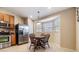 Eat-in kitchen with stainless steel appliances, wood cabinets, and ample counter space at 2138 Mirasol Dr, Winter Haven, FL 33881