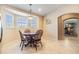 Inviting eat-in kitchen with bay window, pendant lighting, and tiled floors at 2138 Mirasol Dr, Winter Haven, FL 33881