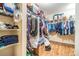 Functional walk-in closet with shelving and hanging space for efficient organization at 2138 Mirasol Dr, Winter Haven, FL 33881