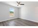 Bright bedroom featuring gray flooring and natural light from window at 2686 Sw 144Th Ct, Ocala, FL 34481