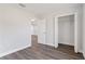 Simple bedroom with neutral walls and floors, closet, and doorway to another room at 2746 Sw 147Th Ct, Ocala, FL 34481