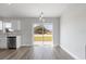 Open dining area with sliding glass doors and modern pendant lighting at 2746 Sw 147Th Ct, Ocala, FL 34481